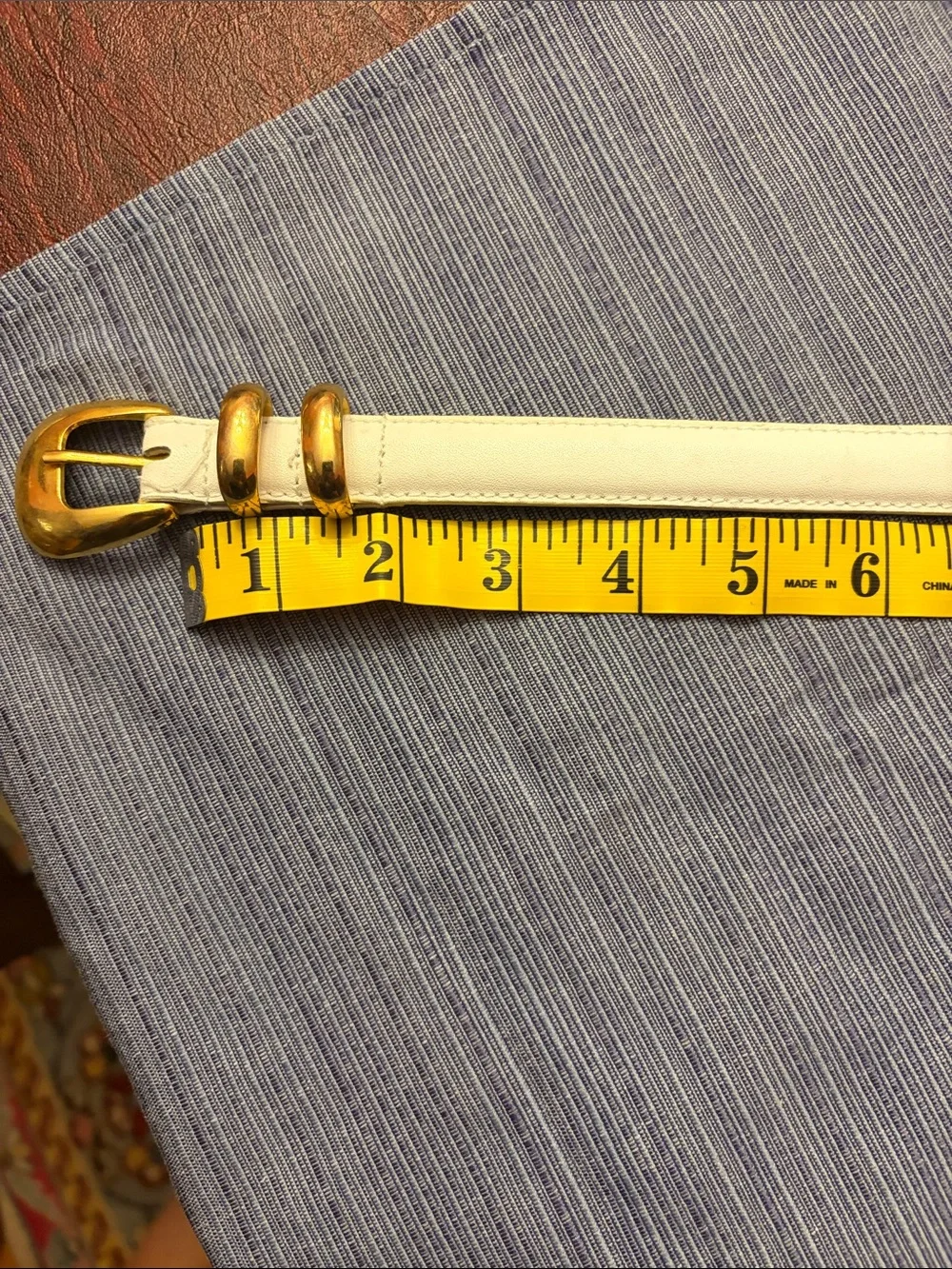 Women’s White Leather Belt with Gold Buckle. End of belt in packaging new